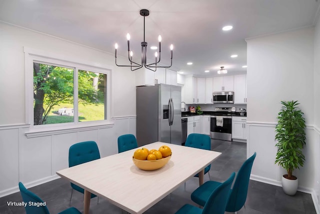 1306 Phyllis Ln, Chattanooga, TN 37421 - dining area with a chandelier, recessed lighting, a wainscoted wall, and a decorative wall