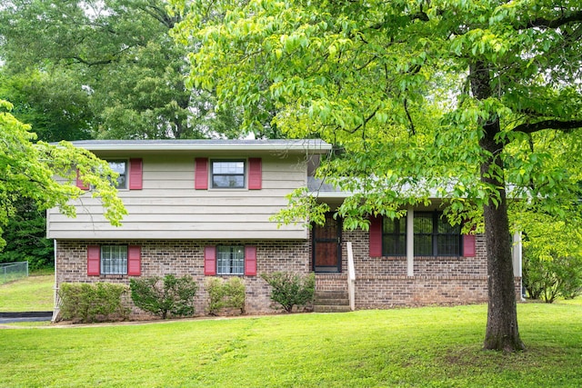 6515 Grubb Rd, Hixson, TN 37343 - tri-level home featuring brick siding and a front yard