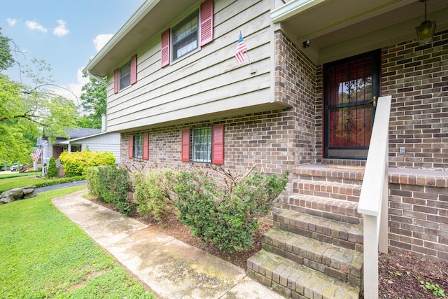 6515 Grubb Rd, Hixson, TN 37343 - property entrance with brick siding and a yard