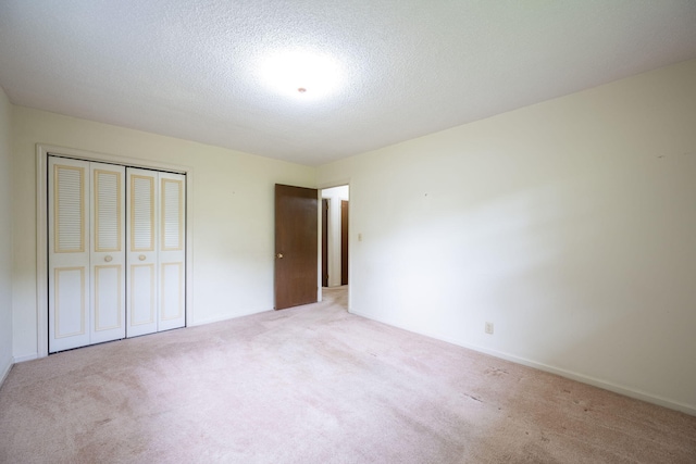 6515 Grubb Rd, Hixson, TN 37343 - unfurnished bedroom featuring a closet, carpet floors, and a textured ceiling