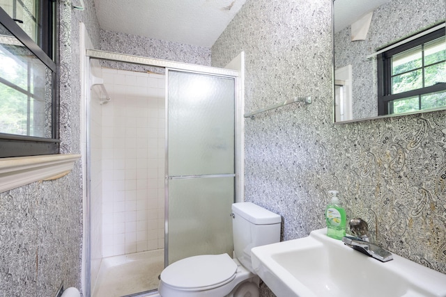 6515 Grubb Rd, Hixson, TN 37343 - bathroom with toilet, a stall shower, a sink, and a textured ceiling