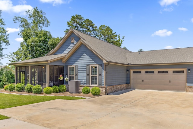 214 Camden Way Unit 38, Dalton, GA 30721 - view of front of property featuring a sunroom, an attached garage, central air condition unit, driveway, and brick siding