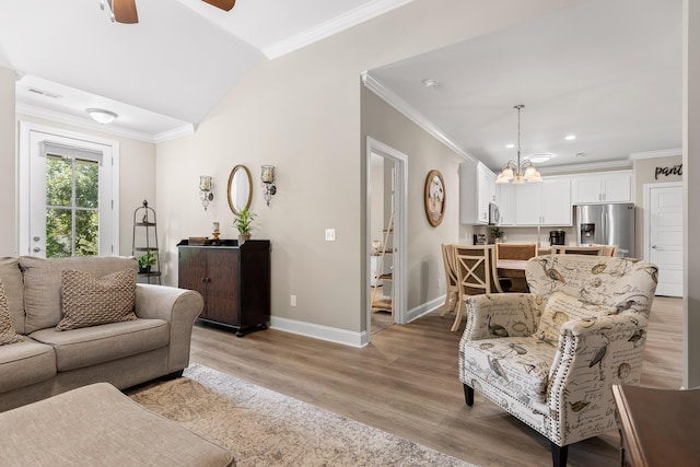214 Camden Way Unit 38, Dalton, GA 30721 - living room with baseboards, light wood-style floors, a chandelier, ornamental molding, and a ceiling fan