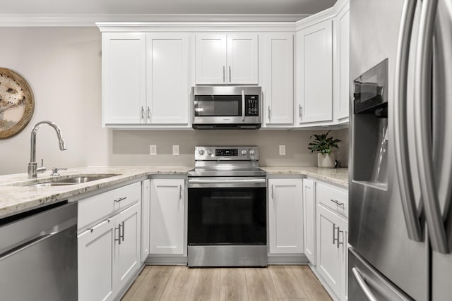 214 Camden Way Unit 38, Dalton, GA 30721 - kitchen featuring stainless steel appliances, a sink, white cabinetry, light stone counters, and light wood-type flooring
