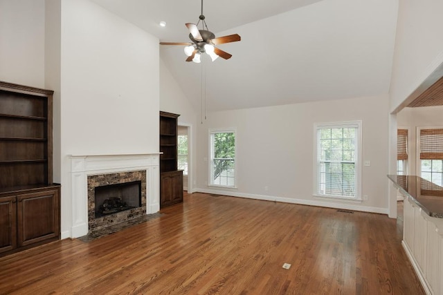 8650 Homecoming Dr, Chattanooga, TN 37421 - unfurnished living room featuring high vaulted ceiling, a ceiling fan, wood finished floors, a fireplace with flush hearth, and healthy amount of natural light