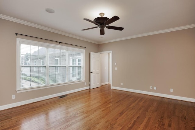 8650 Homecoming Dr, Chattanooga, TN 37421 - empty room featuring healthy amount of natural light, baseboards, crown molding, and wood finished floors