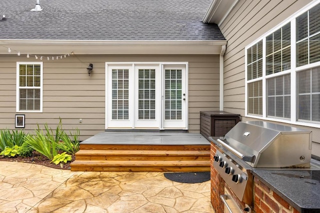 8650 Homecoming Dr, Chattanooga, TN 37421 - view of exterior entry featuring a deck, roof with shingles, a patio area, and an outdoor kitchen