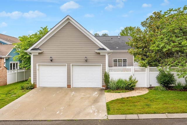 8650 Homecoming Dr, Chattanooga, TN 37421 - view of front facade featuring concrete driveway, an attached garage, and a shingled roof