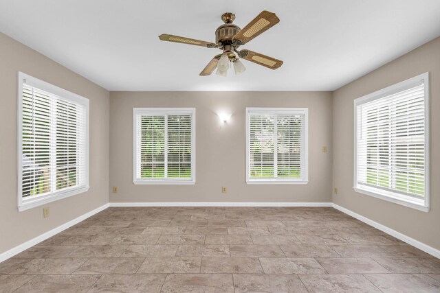 2434 Haven Cove Ln, Chattanooga, TN 37421 - unfurnished room featuring baseboards, stone finish floors, and ceiling fan