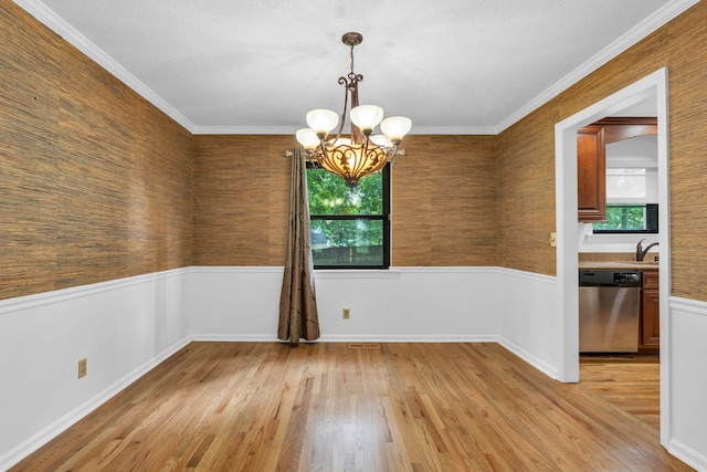 2434 Haven Cove Ln, Chattanooga, TN 37421 - spare room with a chandelier, wainscoting, light wood finished floors, a sink, and crown molding