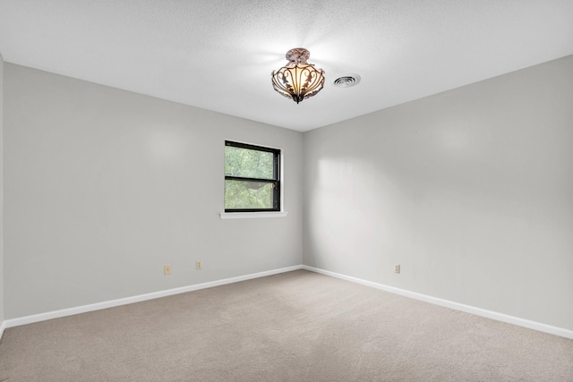 2434 Haven Cove Ln, Chattanooga, TN 37421 - unfurnished room with baseboards, carpet flooring, and a chandelier