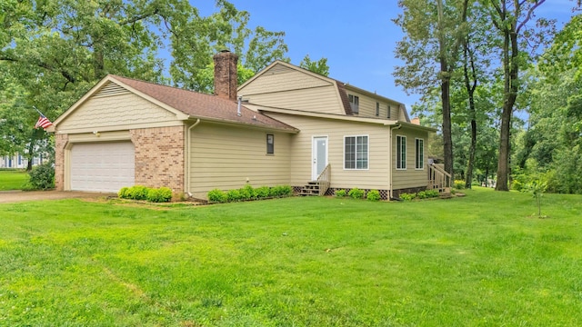 2434 Haven Cove Ln, Chattanooga, TN 37421 - view of front of home featuring a chimney, a front lawn, brick siding, asphalt driveway, and a shingled roof