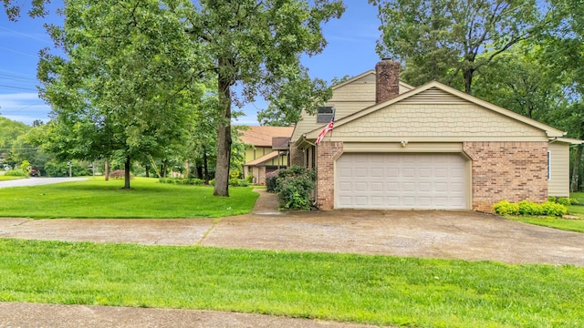 2434 Haven Cove Ln, Chattanooga, TN 37421 - view of front of property with concrete driveway, brick siding, a garage, a chimney, and a front lawn