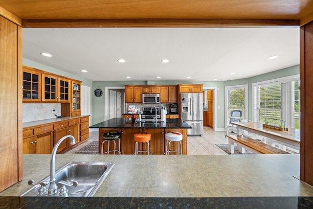 727 E Dumplin Valley Rd, Jefferson City, TN 37760 - kitchen with stainless steel appliances, decorative backsplash, brown cabinetry, recessed lighting, and a sink