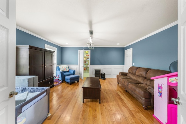 727 E Dumplin Valley Rd, Jefferson City, TN 37760 - living room with light wood finished floors, a wainscoted wall, ornamental molding, and recessed lighting