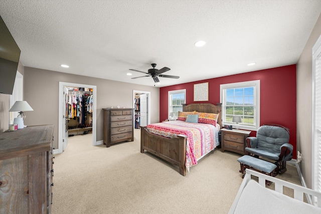 727 E Dumplin Valley Rd, Jefferson City, TN 37760 - bedroom featuring a walk in closet, light colored carpet, recessed lighting, ceiling fan, and a closet
