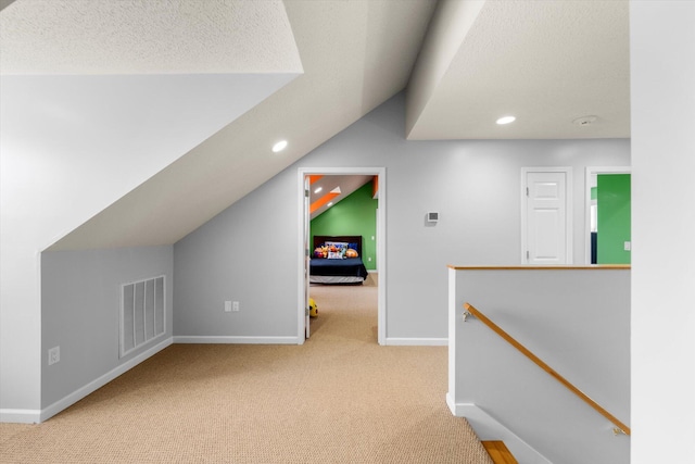 727 E Dumplin Valley Rd, Jefferson City, TN 37760 - additional living space with carpet floors, vaulted ceiling, baseboards, recessed lighting, and a textured ceiling