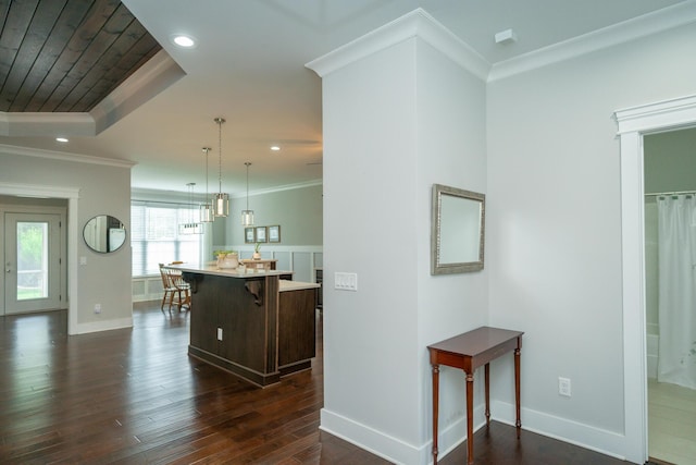 2062 Belleau Village Ln, Chattanooga, TN 37421 - kitchen featuring a kitchen bar, dark wood-style flooring, a kitchen island, light countertops, and recessed lighting