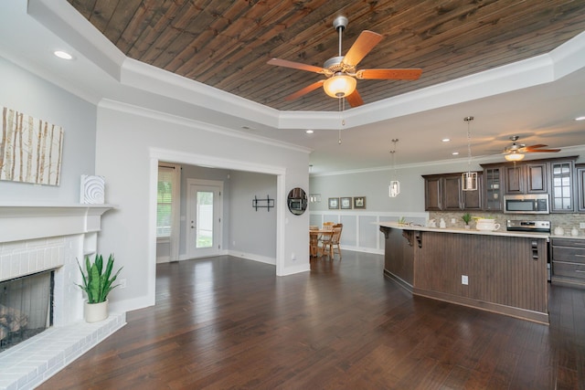 2062 Belleau Village Ln, Chattanooga, TN 37421 - kitchen with stainless steel microwave, a raised ceiling, ceiling fan, a breakfast bar area, and wood ceiling