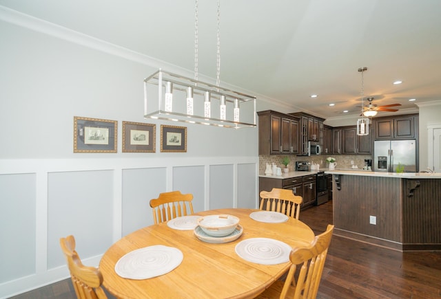 2062 Belleau Village Ln, Chattanooga, TN 37421 - dining area featuring ceiling fan, dark wood-type flooring, crown molding, recessed lighting, and a decorative wall