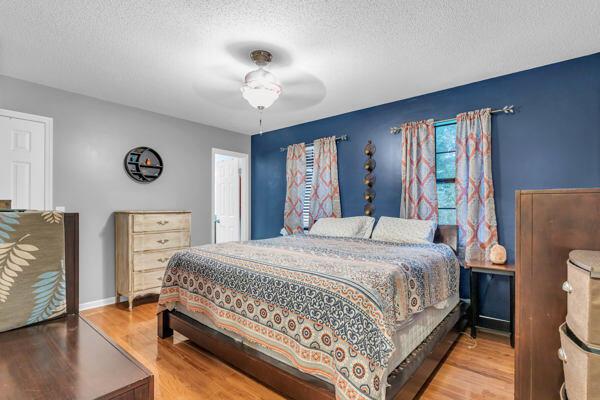 270 Rolling Meadows Dr, Ringgold, GA 30736 - bedroom with wood finished floors, a textured ceiling, and ceiling fan