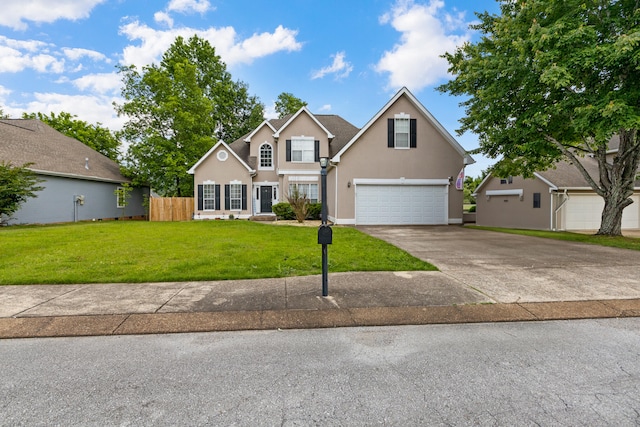 8021 Hamilton Mill Dr, Chattanooga, TN 37421 - traditional home featuring a garage, stucco siding, and driveway