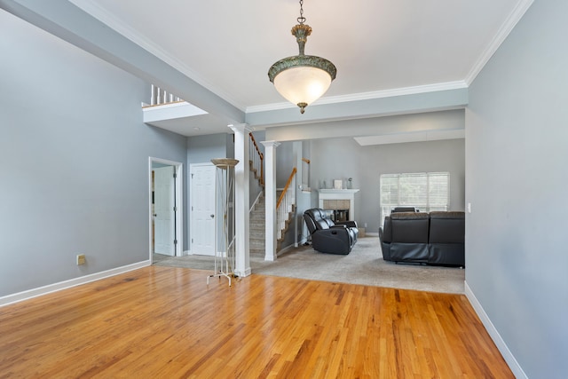 8021 Hamilton Mill Dr, Chattanooga, TN 37421 - living area with baseboards, wood finished floors, ornamental molding, stairway, and a fireplace