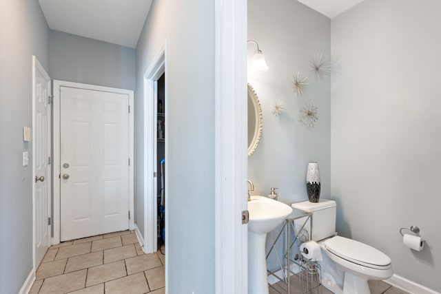 8021 Hamilton Mill Dr, Chattanooga, TN 37421 - bathroom with toilet, tile patterned flooring, baseboards, and a sink