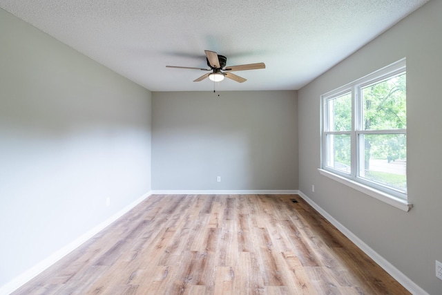 8539 Ricardo Ln, Hixson, TN 37343 - empty room with ceiling fan, light wood-style floors, and baseboards
