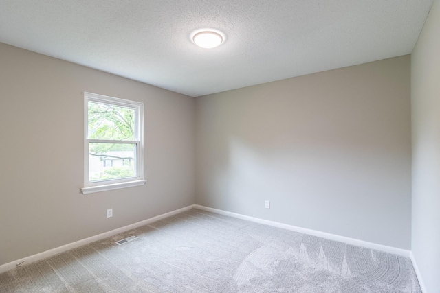 8539 Ricardo Ln, Hixson, TN 37343 - spare room with light carpet, baseboards, and a textured ceiling