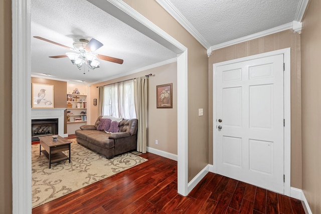 9 Maple Ln, Fort Oglethorpe, GA 30742 - entryway featuring dark wood-style flooring, a textured ceiling, baseboards, a fireplace, and ceiling fan