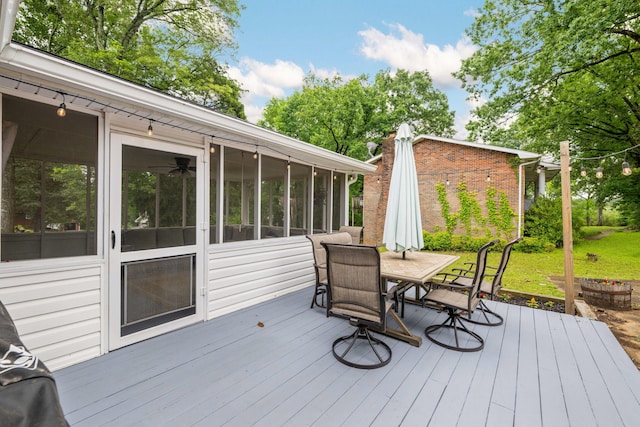 9 Maple Ln, Fort Oglethorpe, GA 30742 - wooden terrace featuring outdoor dining space and a sunroom