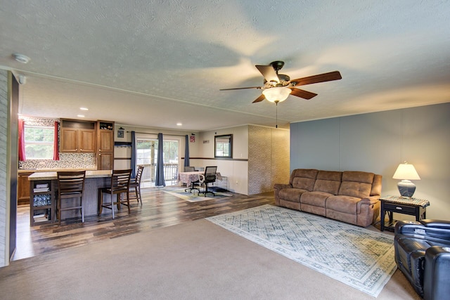 452 Davenport Rd, Resaca, GA 30735 - carpeted living area featuring ceiling fan, a textured ceiling, and wood finished floors
