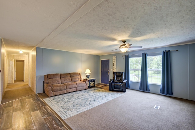 452 Davenport Rd, Resaca, GA 30735 - living room featuring ceiling fan, a textured ceiling, and wood finished floors