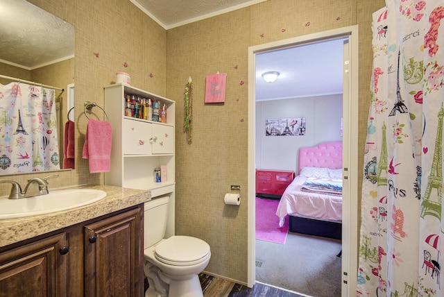 452 Davenport Rd, Resaca, GA 30735 - full bath featuring crown molding, vanity, wood finished floors, toilet, and ensuite bathroom