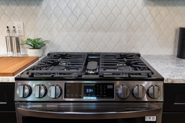 300 Dogwood Ln, Fort Oglethorpe, GA 30742 - kitchen view of gas range and tasteful backsplash