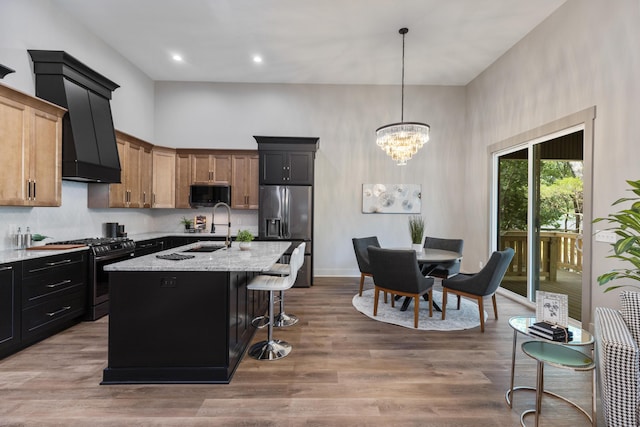 300 Dogwood Ln, Fort Oglethorpe, GA 30742 - kitchen featuring gas range oven, black microwave, stainless steel fridge with ice dispenser, a towering ceiling, and a kitchen bar