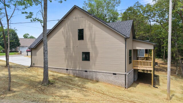 300 Dogwood Ln, Fort Oglethorpe, GA 30742 - view of home's exterior with crawl space, roof with shingles, concrete driveway, and covered porch
