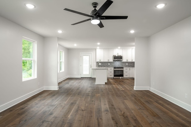 3914 Bennett Rd, Chattanooga, TN 37412 - unfurnished living room featuring baseboards, dark wood-type flooring, recessed lighting, and ceiling fan