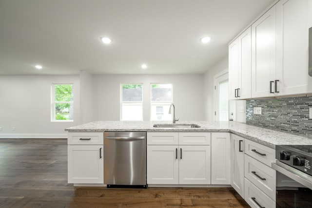 3914 Bennett Rd, Chattanooga, TN 37412 - kitchen featuring stainless steel appliances, a sink, light stone counters, a peninsula, and white cabinets