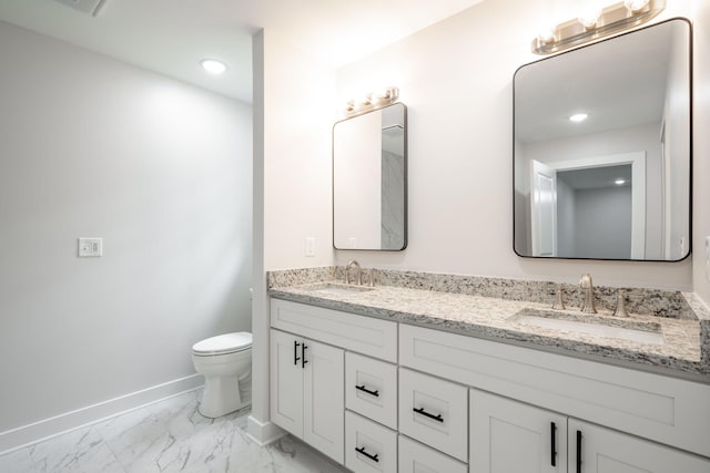 3914 Bennett Rd, Chattanooga, TN 37412 - full bathroom featuring baseboards, double vanity, toilet, marble finish floors, and recessed lighting