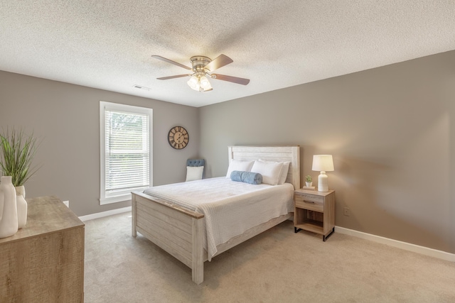 4907 Mccallie Ave, Apison, TN 37302 - bedroom with light colored carpet, ceiling fan, and a textured ceiling