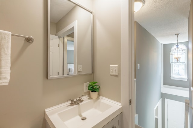 4907 Mccallie Ave, Apison, TN 37302 - bathroom with vanity and a textured ceiling