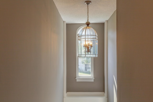 4907 Mccallie Ave, Apison, TN 37302 - detailed view of a chandelier and a textured ceiling