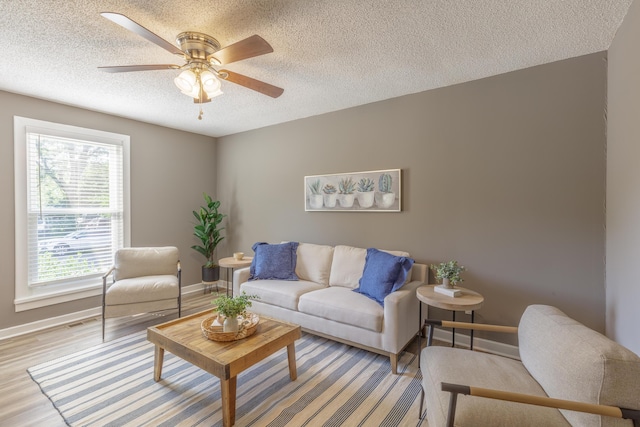 4907 Mccallie Ave, Apison, TN 37302 - living room with a textured ceiling, a ceiling fan, and wood finished floors