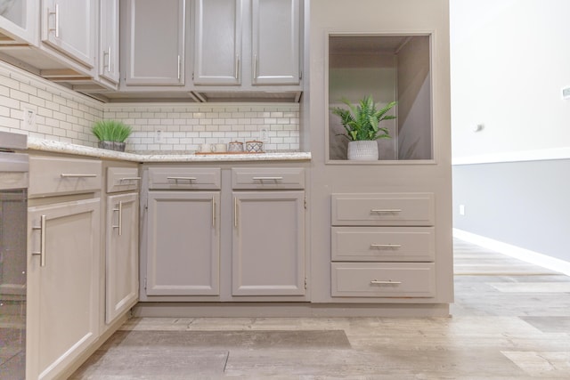 4907 Mccallie Ave, Apison, TN 37302 - kitchen with tasteful backsplash and light wood finished floors