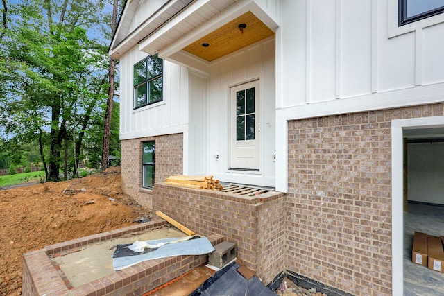 10907 Dolly Pond Rd, Ooltewah, TN 37363 - view of exterior entry with board and batten siding and brick siding