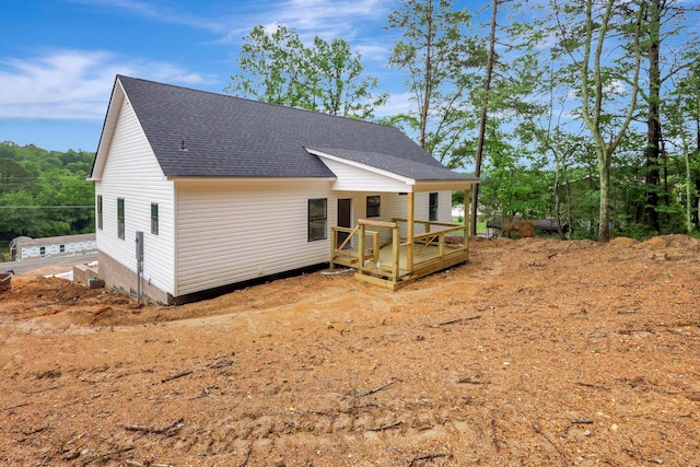 10907 Dolly Pond Rd, Ooltewah, TN 37363 - back of property with roof with shingles and a wooden deck