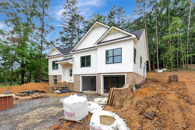 10907 Dolly Pond Rd, Ooltewah, TN 37363 - view of front of property with board and batten siding, brick siding, and roof with shingles