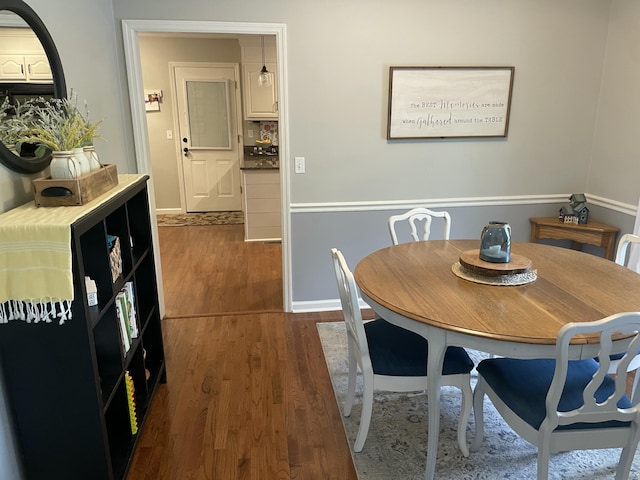 610 Hickory Ridge Trl, Ringgold, GA 30736 - dining area featuring dark wood-style floors and baseboards